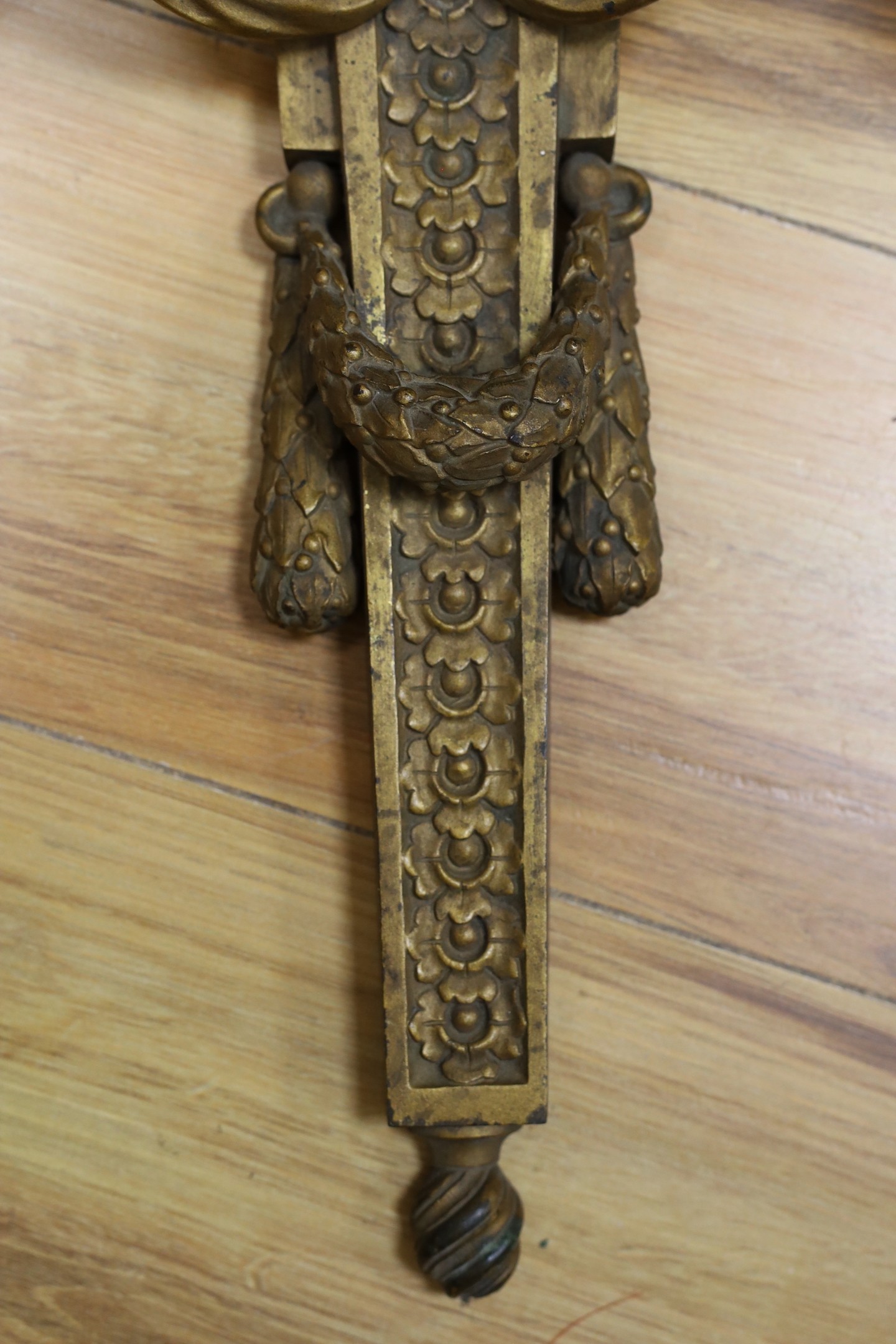 A contemporary bronze three branch wall sconce, 64cm